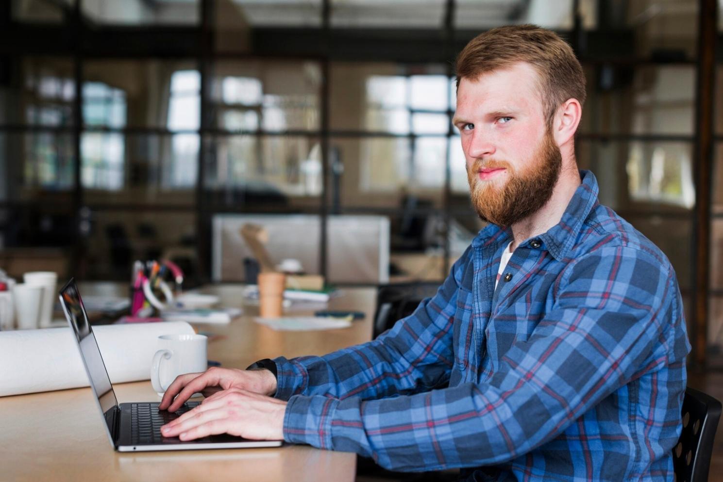 Team reviewing test automation results on large screen with code coverage and failure analysis graphs